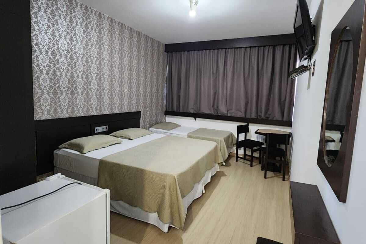 Economy Triple Room, 1 Bedroom | Desk, laptop workspace, blackout curtains