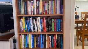 A bookshelf with a variety of books. - My Hideaway - Pet Friendly (Callala Beach)
