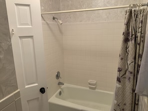 Combined shower/tub, hair dryer, towels, toilet paper