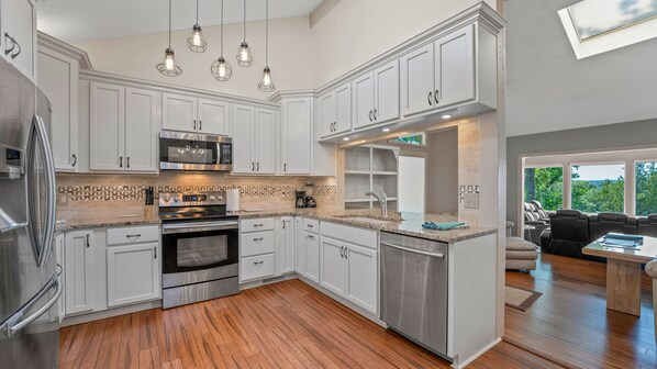 Microwave, dishwasher, coffee/tea maker, cookware/dishes/utensils