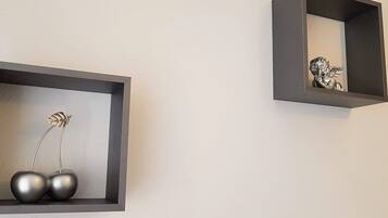 Two wall-mounted shelves with minimalist decor.