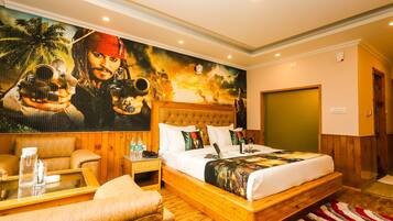 A spacious bedroom with a large bed, wooden headboard, and a mural of a pirate on the wall.