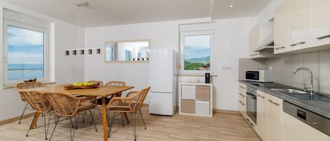 Apartment (A1) | Private kitchen | Fridge, microwave, oven, stovetop