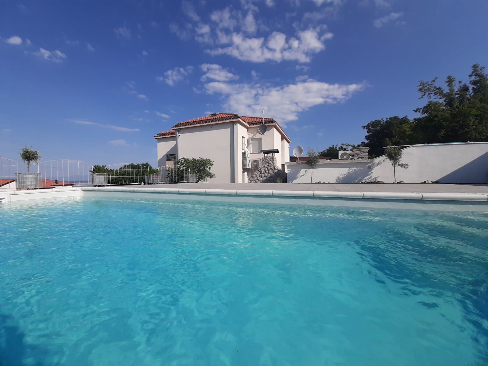 Outdoor pool, a heated pool, pool loungers