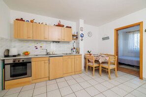 Apartment (A1) | Private kitchen | Fridge, oven, stovetop, electric kettle - Apartment Marijo (Malinska-Dubasnica)
