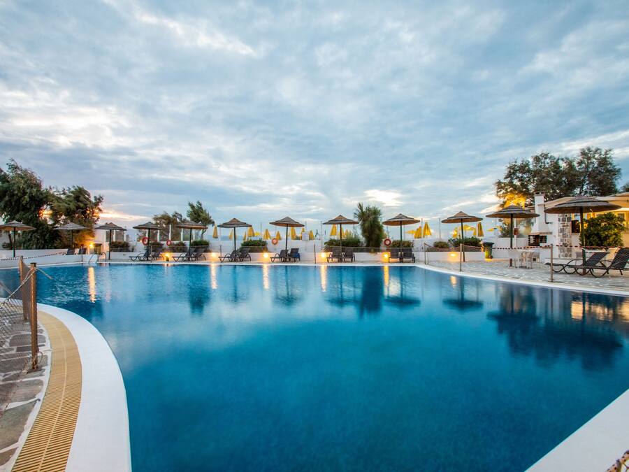 Outdoor pool, open 10:00 AM to 6:00 PM, pool umbrellas, pool loungers