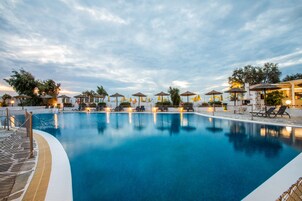 Outdoor pool, open 10:00 AM to 6:00 PM, pool umbrellas, sun loungers