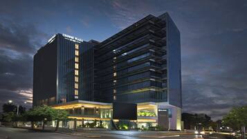 A modern hotel with a prominent sign reading "Crowne Plaza".
