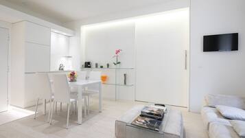 Deluxe Apartment | Living area | Flat-screen TV