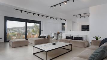 Luxury Villa, Private Pool, Sea View | Living room | 50-inch Smart TV with digital channels, TV, fireplace