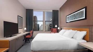 In-room safe, desk, laptop workspace, bed sheets