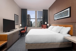 In-room safe, desk, laptop workspace, bed sheets