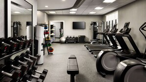 A gym with treadmills, dumbbells, and exercise balls. - Home2 Suites by Hilton Bend (Bend)