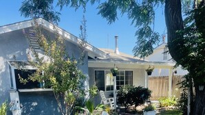 A house with a patio area, potted plants, and a wooden fence. - The Bluebird House Near Wineries Historic Downtown Murrieta  (Murrieta)
