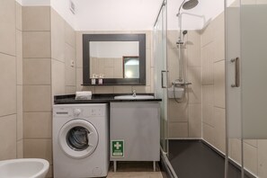 Shower, hair dryer, soap, shampoo