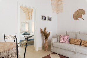 Comfort Apartment | Living area | 24-inch flat-screen TV with cable channels, TV - Cementine Traditional Suites (Ostuni)