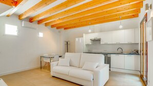 A modern kitchen with white cabinets and a stainless steel range hood. - DUPLEX PALMA APARTMENT ETV/5551 (Palma de Mallorca)