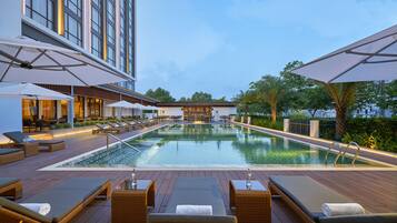 Outdoor pool, open 7:00 AM to 8:00 PM, pool umbrellas