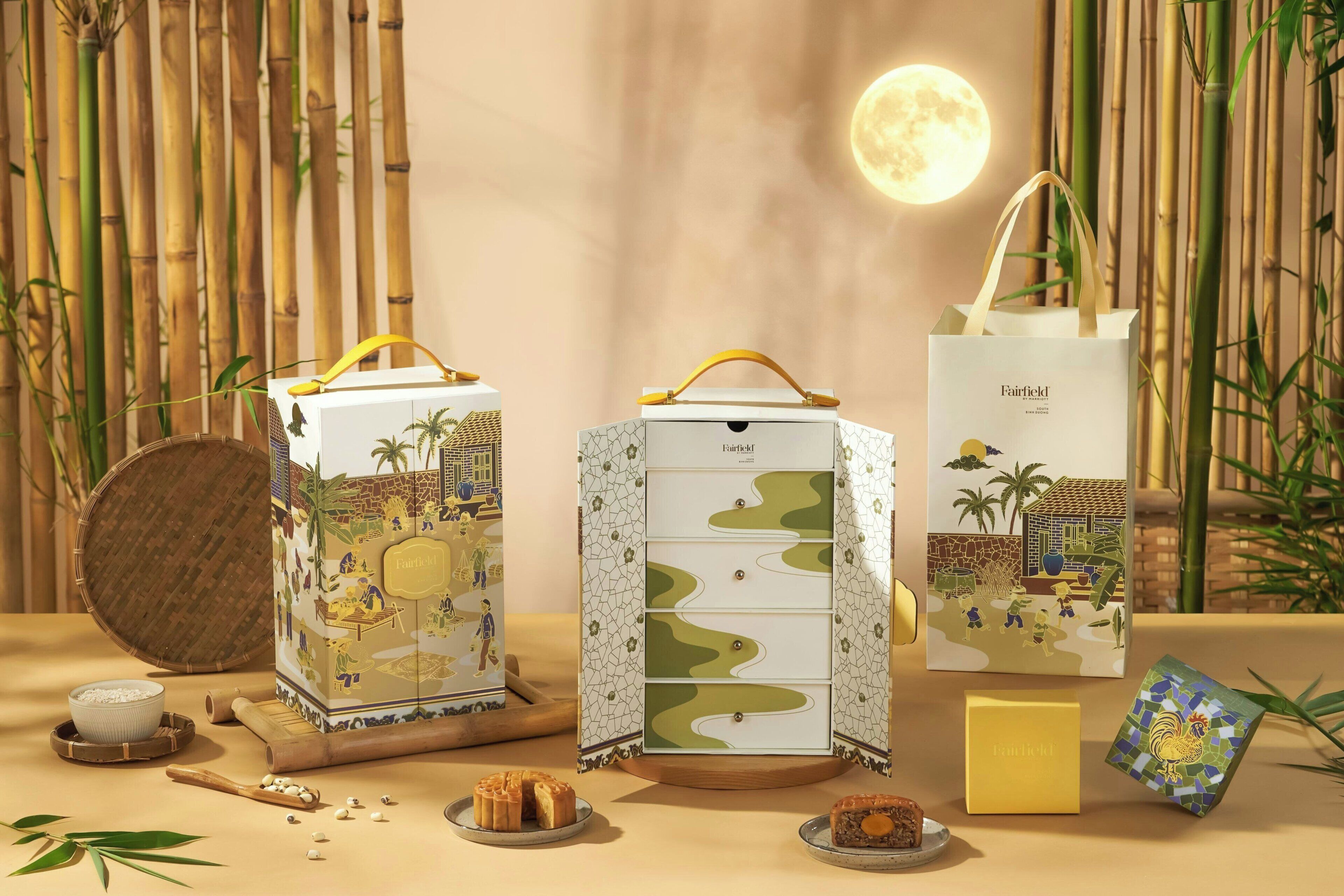 A bamboo backdrop with a moon, a white bag with a rooster design, and a white box with a rooster design.