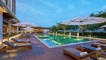 Outdoor pool, open 7:00 AM to 8:00 PM, pool umbrellas