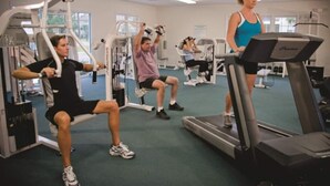 A gym with exercise equipment, treadmills, and weight machines. - 3 Bedrm, 2 Bath Ground-floor Lake-side, 5 min walk to beach. Great for families! (North Myrtle Beach)