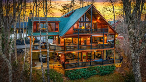 A multi-story log cabin with a balcony, surrounded by trees. - Cabin in the Clouds, Best Views, Hot Tub, Games, Firepit, Pets, Flat Paved Drive (Mineral Bluff)