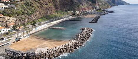 On the beach, sun-loungers, beach towels