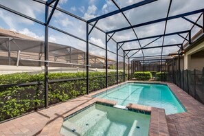 A heated pool, sun loungers