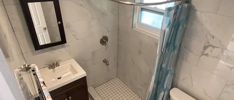 Shower, towels, soap, toilet paper