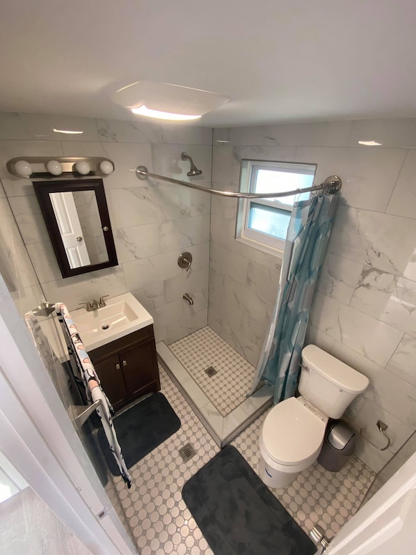 Shower, towels, soap, toilet paper
