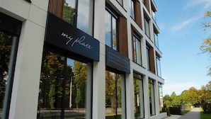 A modern building with a sign reading "my place" and "BAR & RESTAURANT". - My Story Gdynia (Gdynia)