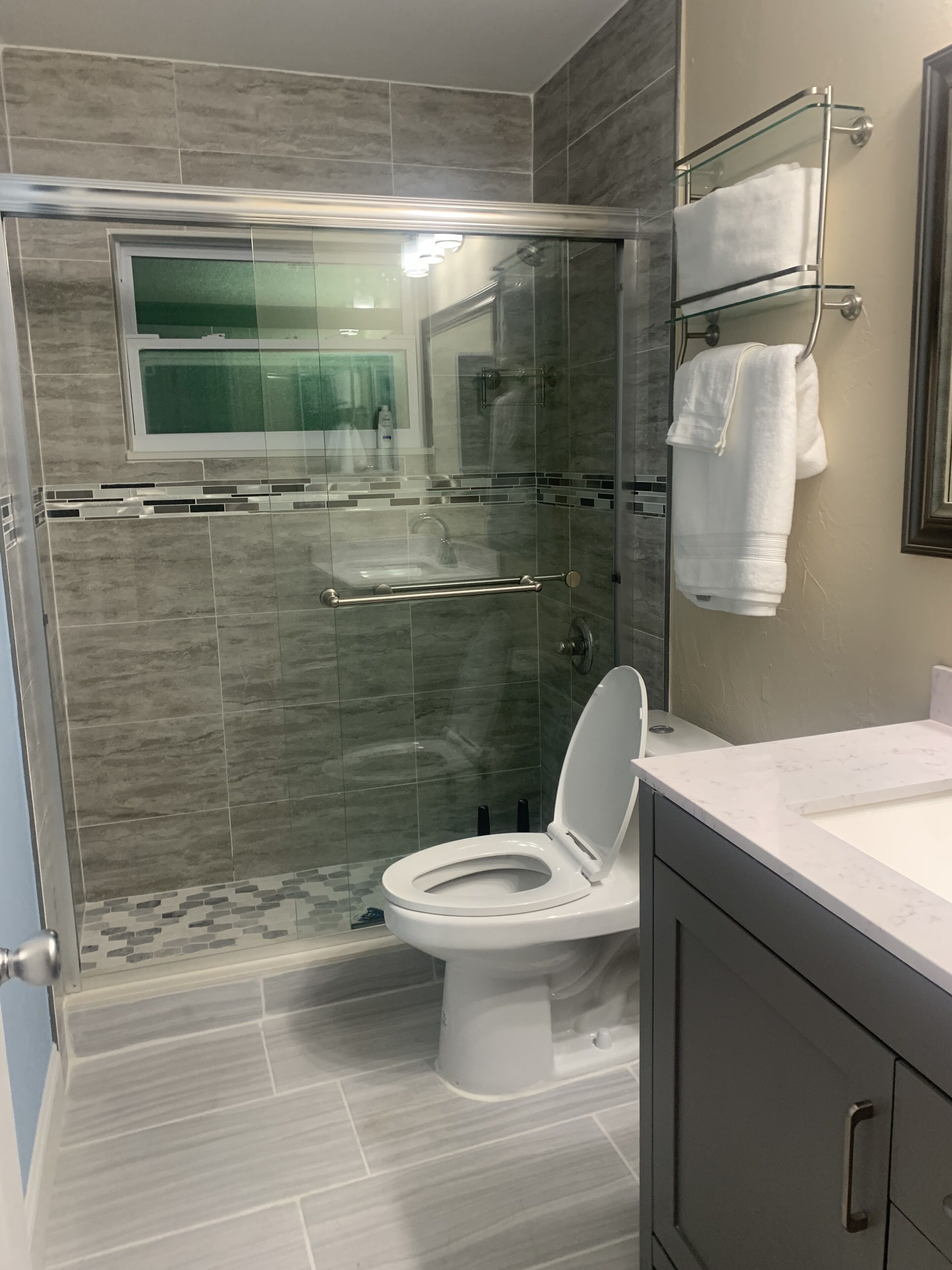 Shower, hair dryer, towels, soap