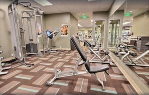 A gym with various exercise equipment, including treadmills, weight machines, and free weights. - Luxury 1BR in Prestigious Honua Kai K430 (Lahaina)