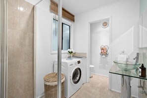 Shower, hair dryer, towels, soap