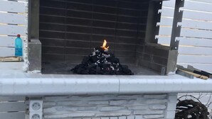 A stone-built outdoor pizza oven with a fire burning inside. - sam29 3-Bed Villa in Monolithos (Monolithos)