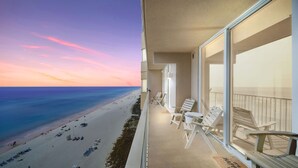 A balcony with a view of a beach and ocean during sunset. - *Sept 6- 8th/Labor Day Open!* Beach chairs included! (Panama City Beach)