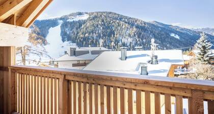 Appartement de vacances "Sis Residenz Bun Sté" avec vue sur la montagne, jacuzzi et sauna