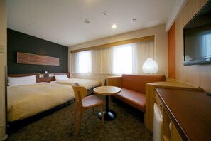 A hotel room with two beds, a sofa, a small table, a chair, a TV, and a lamp. - Via inn Hiroshima (Hiroshima)