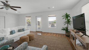 A modern living room with a white sofa, a wooden coffee table, and a television on a wooden stand. - ☀️GulfViews~Additional Carriage House~100yds2Beach~PRIMELocation~Grayton Escape (Santa Rosa Beach)