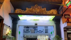 The entrance of the Hung Phat Hotel with a visible staircase and a sign above the entrance. - Hung Phat Hotel (Ho Chi Minh City)