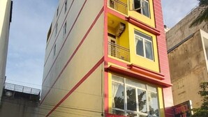 A multi-story building with a prominent sign reading "HOTEL AN BINH" at the entrance. - An Binh Hotel (Ho Chi Minh City)