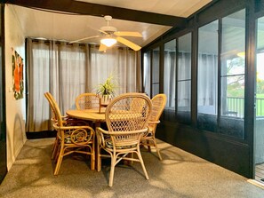 Enjoy meals with family and friends around the large dining table, surrounded by comfortable chairs.