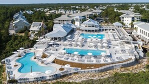 A resort with multiple pools, sun loungers, and a large outdoor area. - Pet Friendly Designer Gem with LSV and Bikes 100 Yards to Camp WaterColor (Santa Rosa Beach)