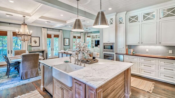 A spacious kitchen with a large island, white cabinetry, and pendant lighting. - Pet Friendly Designer Gem with LSV and Bikes 100 Yards to Camp WaterColor (Santa Rosa Beach)