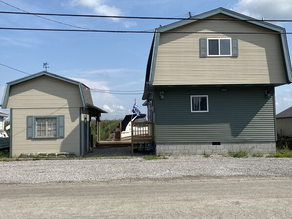 A two-story house with a small porch and a garage.