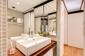 Combined shower/bathtub, jetted bath, hair dryer, bidet