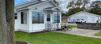 Life is Better at the Lake!  Over 120 ft of frontage on Houghton Lake!