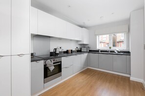 Microwave, dishwasher, dining tables