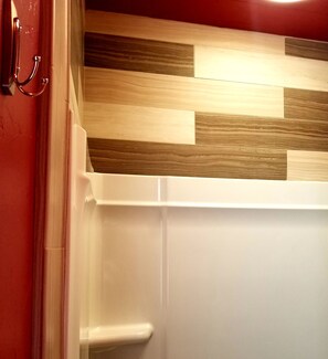 Shower, hair dryer, towels, toilet paper