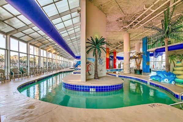 Relax by the pool surrounded by a deck and lounge chairs.